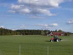 Free Stock Photo: Red tractor on a farm field