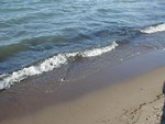 Free Stock Photo: Closeup of small waves on the beach