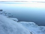 Free Stock Photo: Ice and snow surrounding a lake