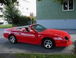 Free Stock Photo: Side view of a convertible red sports car