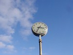 Free Stock Photo: An outdoor clock with a blue sky background
