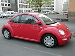 Free Stock Photo: A red Volkswagon Beetle parked