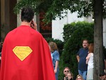 Free Stock Photo: Man in Superman costume on cell phone at Dragoncon 2008