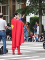 Free Stock Photo: Superman on a cell phone crossing the street at 2008 Dragoncon parade