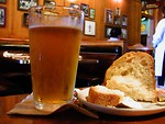 Free Stock Photo: A glass of beer and bread in a bar