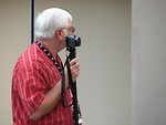 Free Stock Photo: Older man with camera on a monopod at 2008 Dragoncon parade