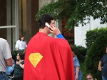 Free Stock Photo: Man in Superman costume on cell phone at Dragoncon 2008