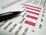 Free Stock Photo: Closeup of a tax income bar graph and a pen.