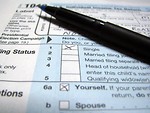 Free Stock Photo: Closeup of a 1040 tax form and a pen