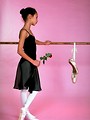 Free Stock Photo: Young ballerina posing with slippers and a rose