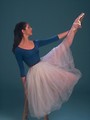 Free Stock Photo: A ballerina posing with a stretched leg on a stool