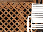Free Stock Photo: White chair by fence