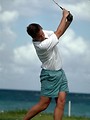 Free Stock Photo: A man swinging a golf club on a course by the ocean