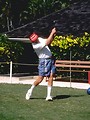 Free Stock Photo: An older man in shorts swinging a golf club