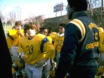 Free Stock Photo: Young football players discuss a plan with their coach