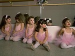 Free Stock Photo: A group of young ballerinas sitting in front of a mirror