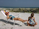 Free Stock Photo: Two young girls relaxing on the beach