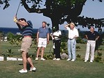 Free Stock Photo: A group of men playing golf by the ocean