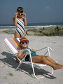 Free Stock Photo: Two young girls in sunglasses relaxing on the beach