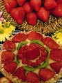 Free Stock Photo: Display of strawberries and kiwi fruit with flowers