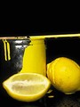 Free Stock Photo: Sliced lemons and a bucket of yellow paint