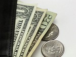 Free Stock Photo: Close-up of dollars and quarters in a wallet
