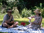 Free Stock Photo: A young boy and girl having a picnic