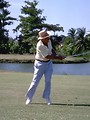 Free Stock Photo: An older man swinging a golf club