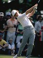 Free Stock Photo: Close-up of a golfer swinging a club with a crowd watching