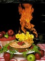 Free Stock Photo: Display of apples and a pie in front of a fire