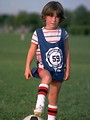 Free Stock Photo: A young boy posing with a soccer ball