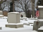 Free Stock Photo: A snow covered graveyard with wreaths and US flags