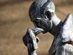 Free Stock Photo: Closeup of a statue of a man with a bird