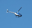 Free Stock Photo: A small blue helicopter in the sky