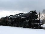 Free Stock Photo: A steam locomotive under a stormy winter sky
