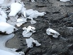 Free Stock Photo: Snow and ice on the edge of a stream.