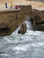 Free Stock Photo: Men fishing in the ocean off a rock cliff