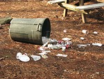 Free Stock Photo: Trash spilling out of a tipped over trash can