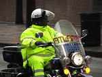 Free Stock Photo: An Atlanta police officer on a motorcycle in the 2009 Atlanta Saint Patricks Day Parade