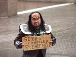 Free Stock Photo: A man in a Klingon costume with sign in the rain in the 2009 Atlanta Saint Patricks Day Parade
