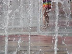 Free Stock Photo: Girl playing in fountain