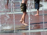 Free Stock Photo: Boys playing in a fountain