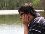 Free Stock Photo: Closeup of a man with glasses looking into the water
