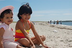 Free Stock Photo: Two young girls sitting on the beach