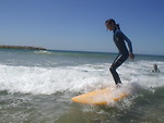 Free Stock Photo: A young girl on a surfboard in the water