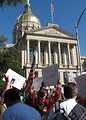 Free Stock Photo: Protest flags and signs in front of the State Capitol building at the 2009 tax day tea party in Atlanta, Georgia
