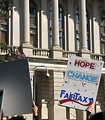 Free Stock Photo: Protest flags and signs in front of the State Capitol building at the 2009 tax day tea party in Atlanta, Georgia