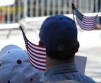 Free Stock Photo: Protesters with flags in their hats at the 2009 tax day tea party in Atlanta, Georgia