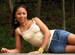 Free Stock Photo: Portrait of a beautiful African American teen girl posing on a stone wall