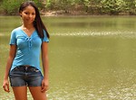 Free Stock Photo: Portrait of a beautiful African American teen girl posing by a lake